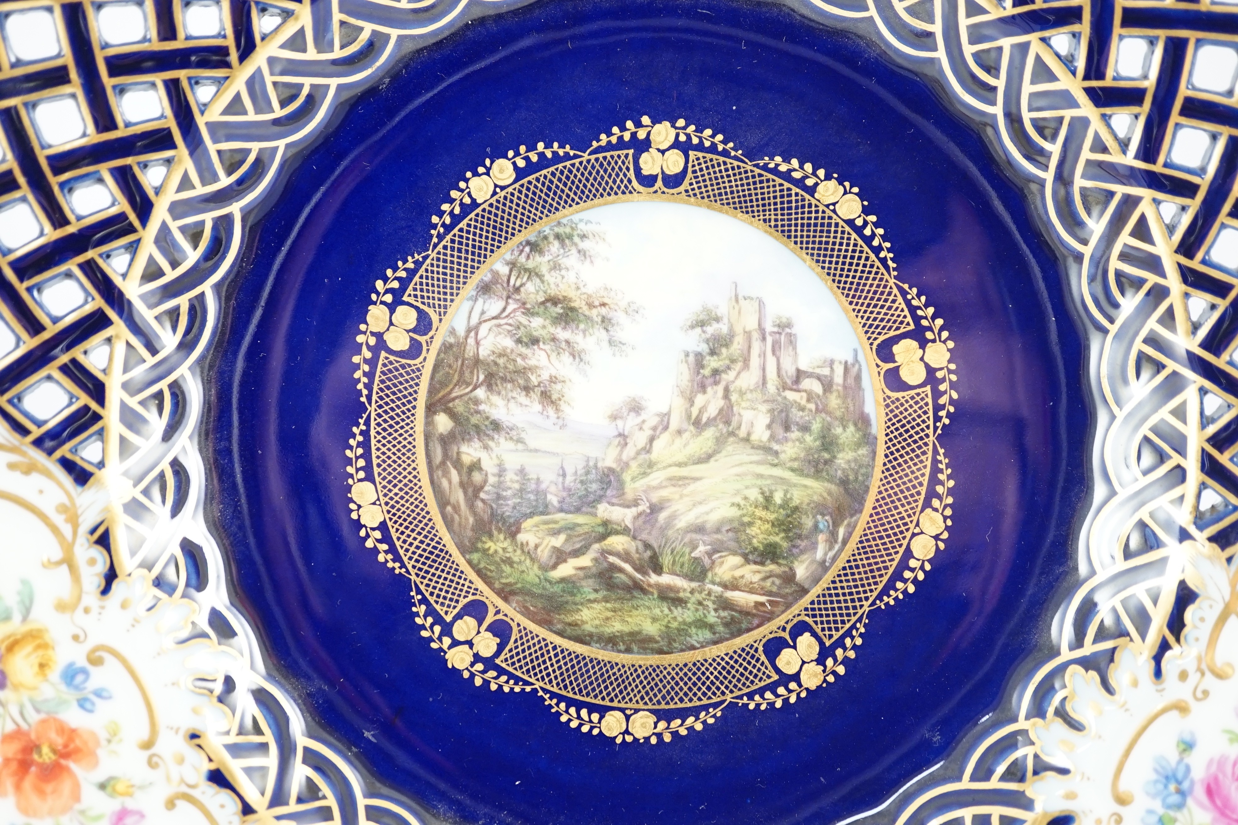 A pair of Meissen reticulated named view plates, 19th century, 23.7cm diameter